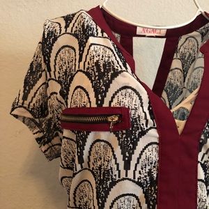 Black, white and red patterned dress top